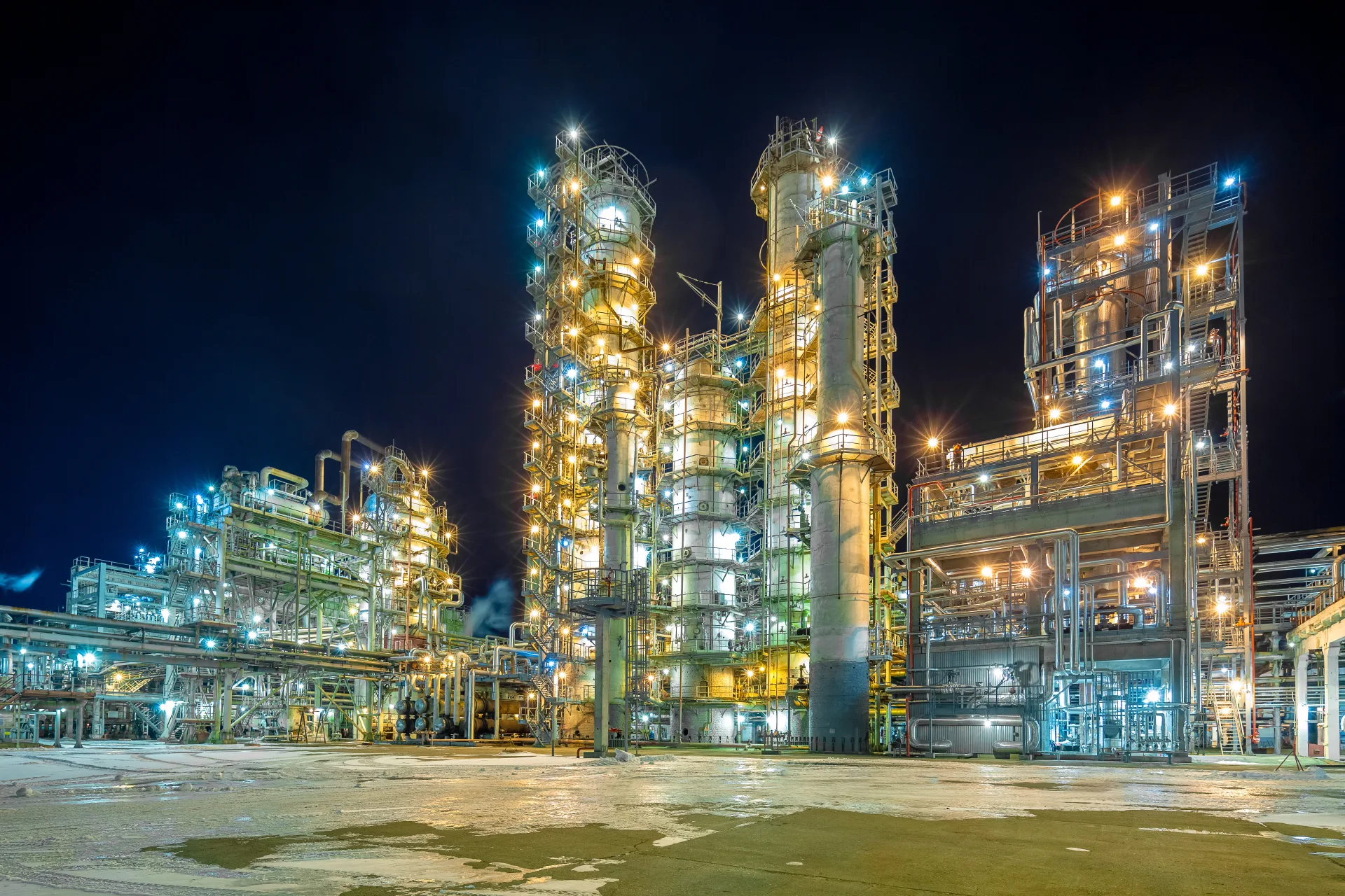 night view of the refinery, distillation columns, blue sky